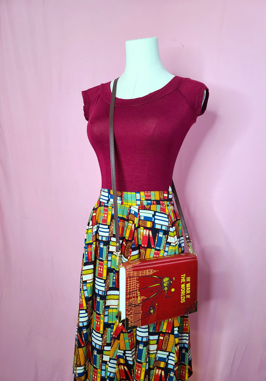 Skirt shown with Retro Boatneck Top in Burgundy, and The War of the Worlds Dark Red Book Crossbody on a mannequin against a pink background
