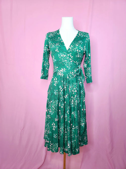 Front of dress on a white mannequin against a pink background