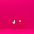A seagull and a pack of French fries earrings on a clear stand against a pink background.