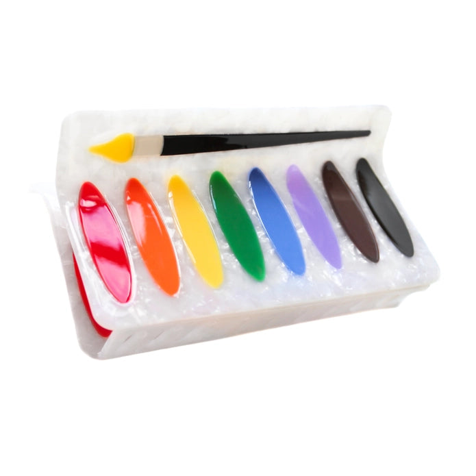 Water color palette hair claw against a white background.