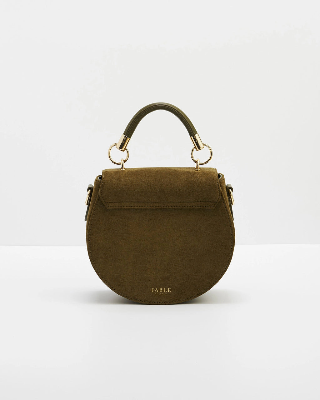 Back of saddle bag with short handle against a white background.