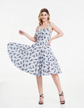 Woman wearing pigeon dress against a white background.