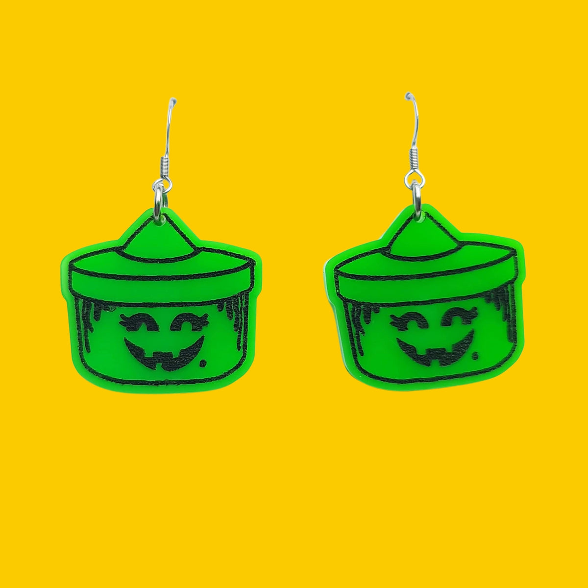 Earrings against yellow background