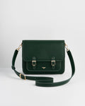 Front of darker green purse with gold buckles and long strap against a white background.