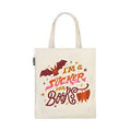 The phrase "I'm a Sucker for Books" in a large yellow, pink, and brown font with two bats on a beige tote against a white background.