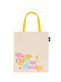 Cream canvas tote with yellow handles and the phrase "Bans Off Our Books" in large rainbow font against a white background.