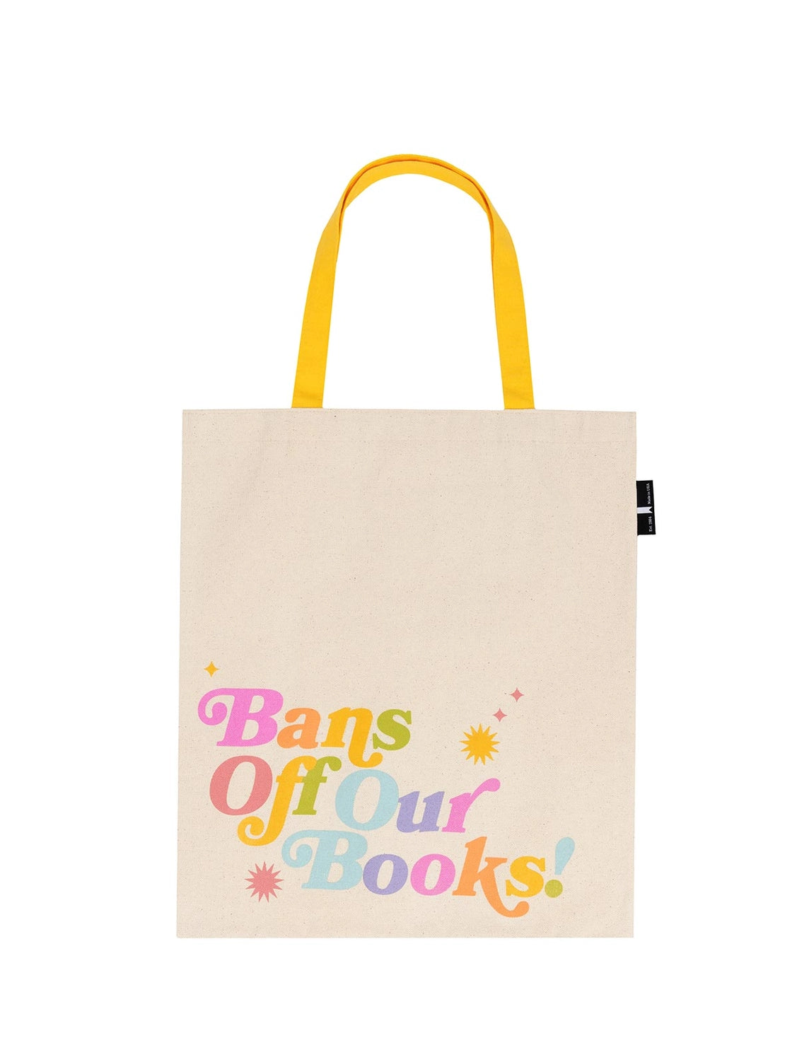 Cream canvas tote with yellow handles and the phrase "Bans Off Our Books" in large rainbow font against a white background.