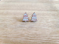 Earrings against wood background